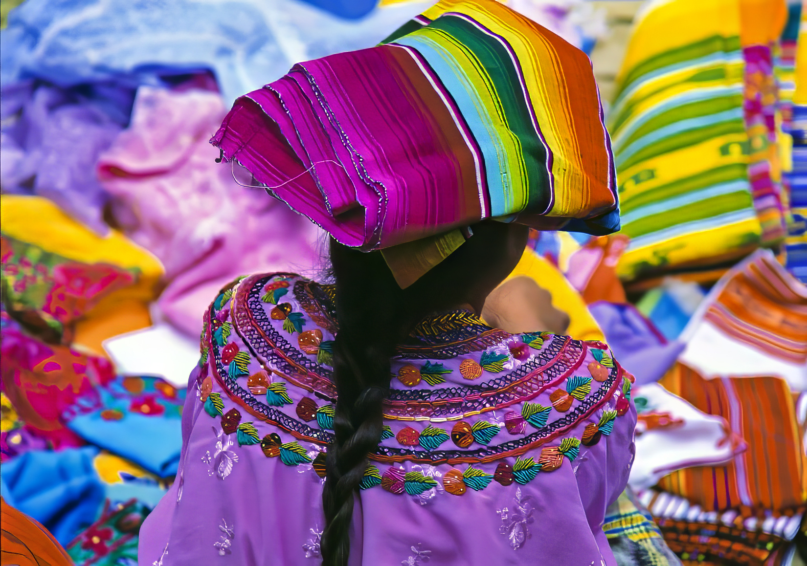 Mayan woman selling clothes at the market. Chichicastenango. (El Quiché) Guatemala.